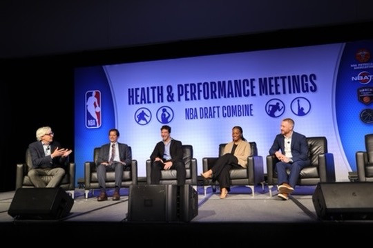Five participants at a health and performance panel discussion
