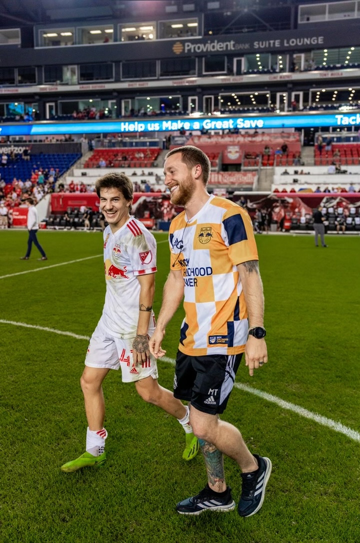 Matt Tuttle walking across a professional soccer field